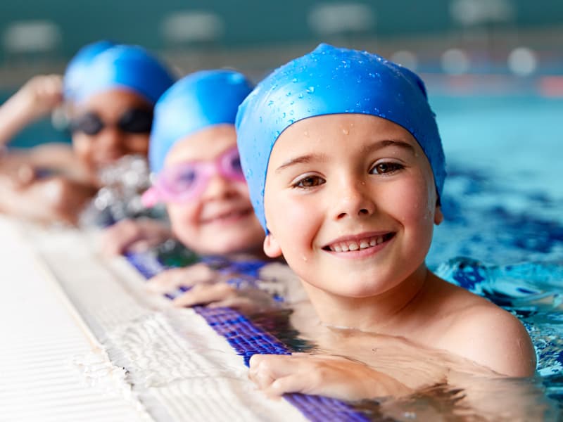 swim-video-thumbnail child with swim cap on in pool